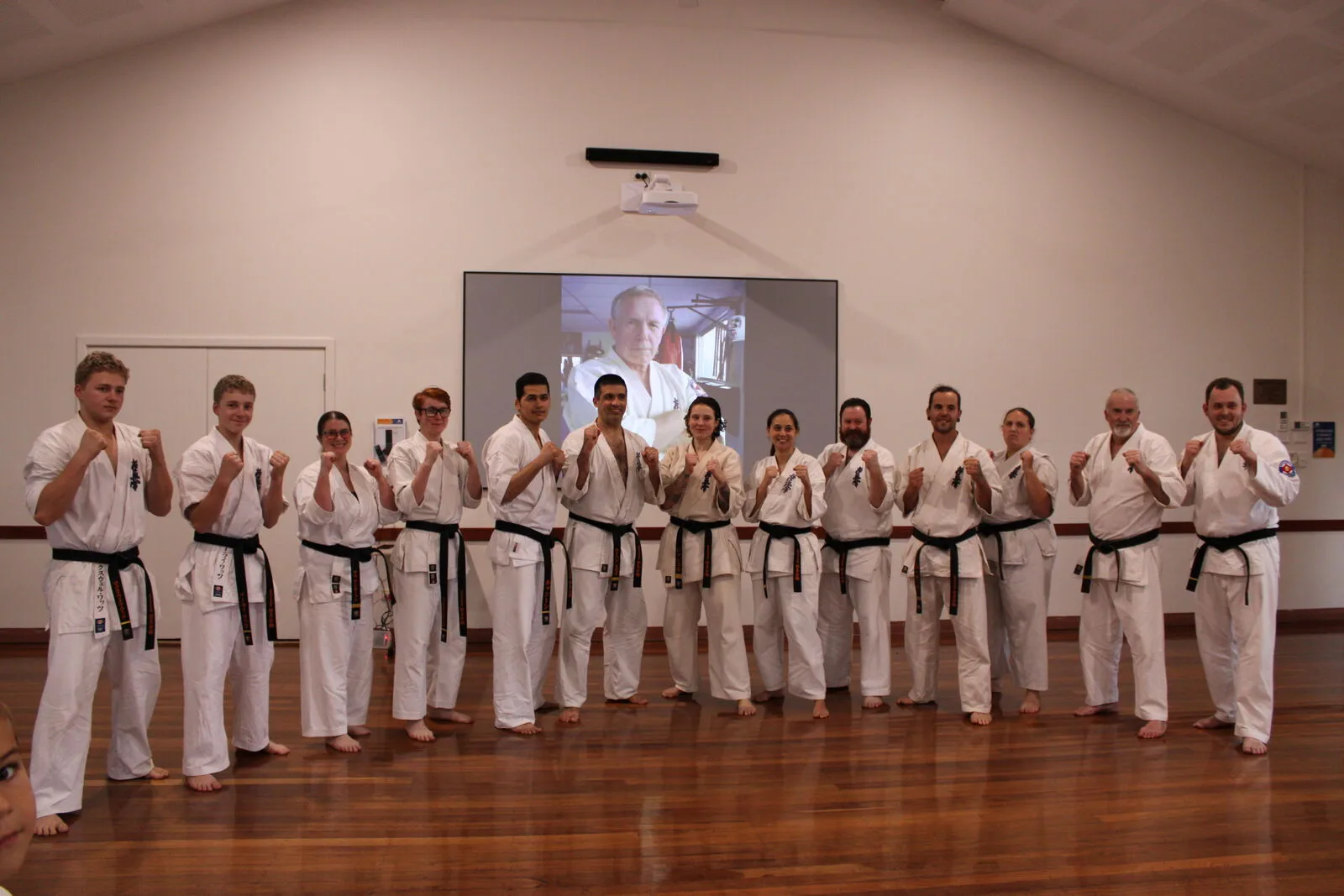 Black belts from multiple dojos training together at the Brighton Karate Fighting Seminar